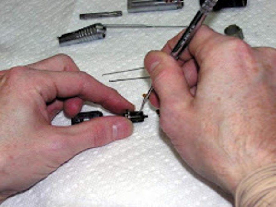 Close-up of precision dental handpiece repair
